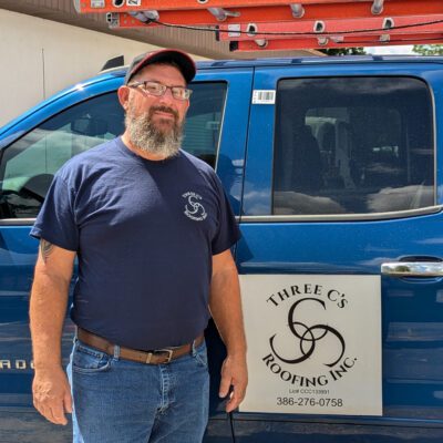 Scott with 3C Roofing stands by his truck